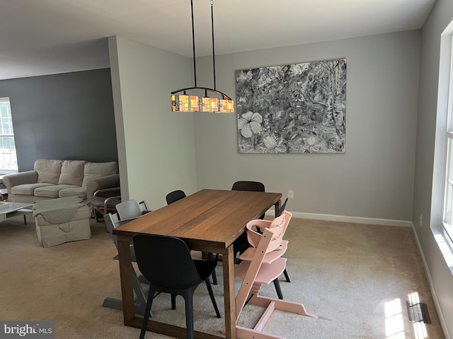 view of carpeted dining area