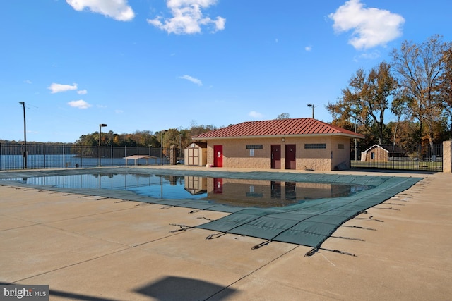 view of swimming pool with a patio area