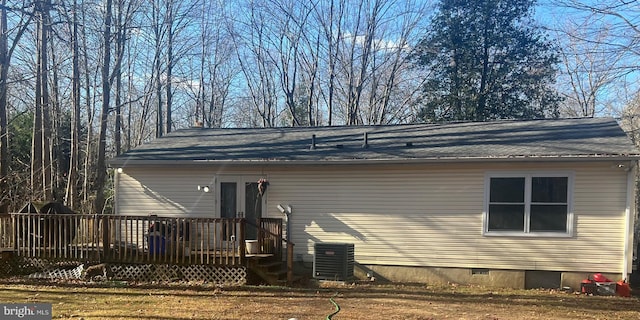 back of property with a wooden deck and cooling unit