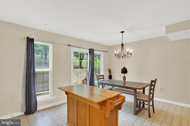 dining space with an inviting chandelier