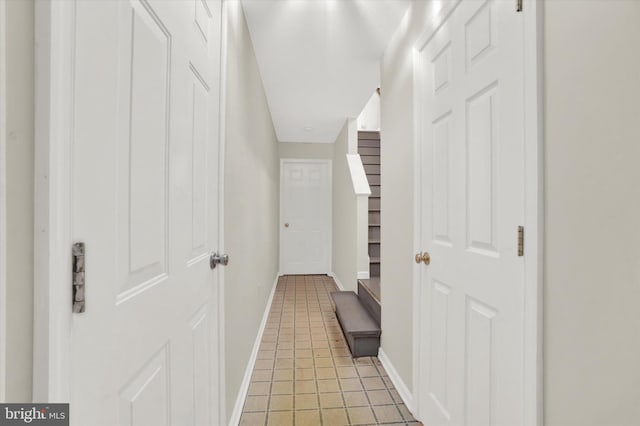 corridor featuring light tile patterned floors