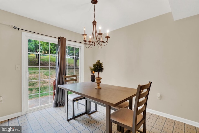 dining area with an inviting chandelier