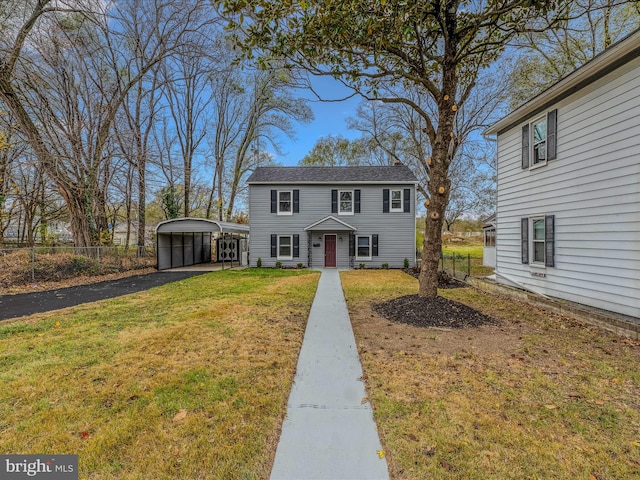 view of front facade featuring a front lawn and a carport