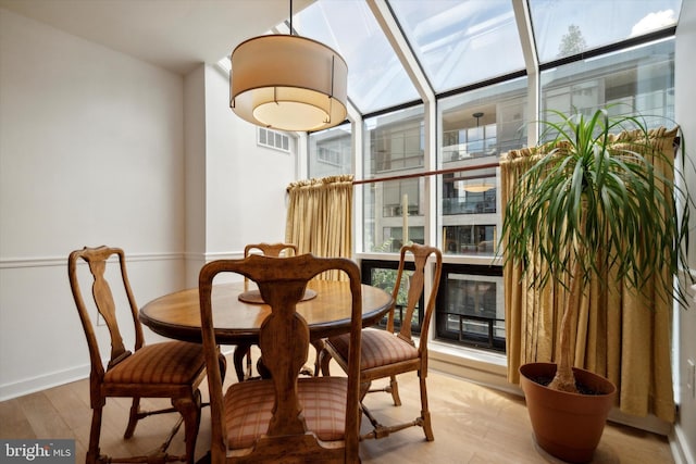 dining area with hardwood / wood-style floors