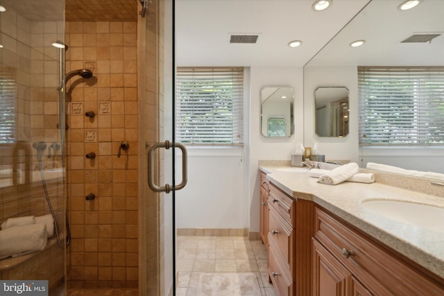 bathroom with vanity and an enclosed shower