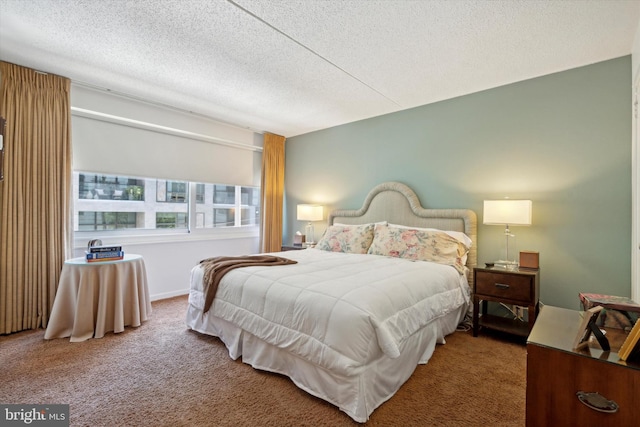 carpeted bedroom featuring a textured ceiling