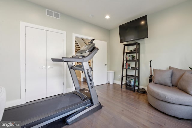 exercise area featuring hardwood / wood-style floors