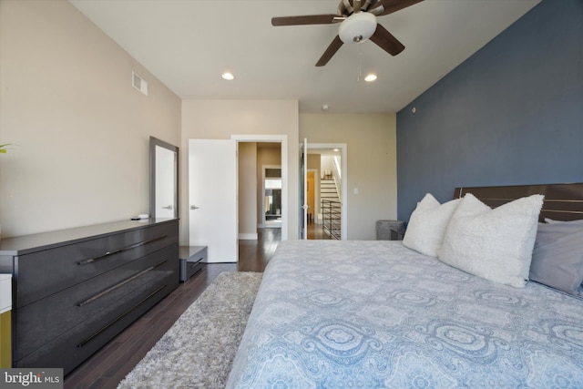 bedroom featuring ceiling fan and dark wood-type flooring