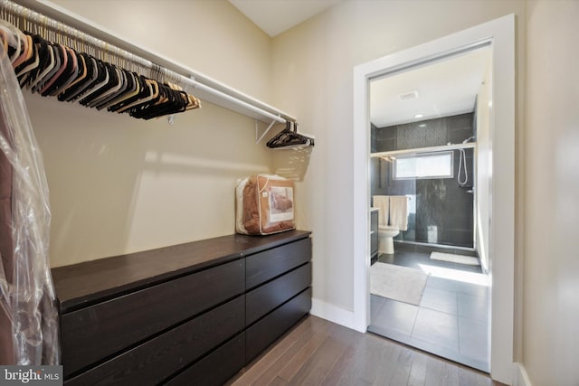 walk in closet featuring hardwood / wood-style floors