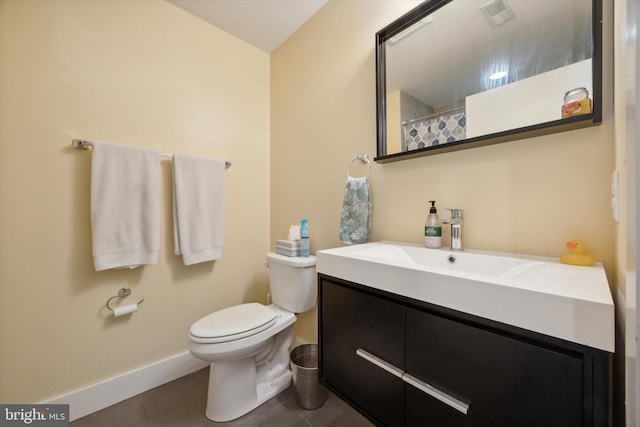 bathroom with tile patterned floors, vanity, toilet, and a shower with curtain