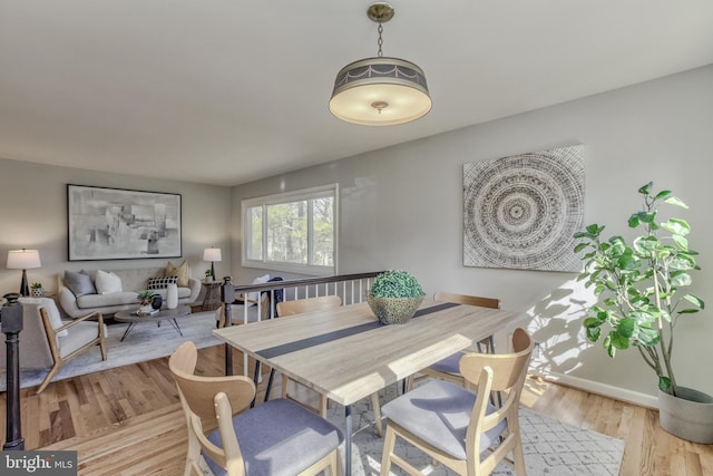 dining area with light wood finished floors