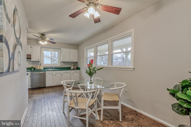 dining area featuring wood finished floors and baseboards