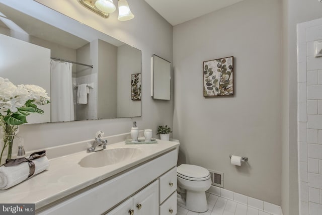 bathroom featuring curtained shower, toilet, vanity, visible vents, and tile patterned floors