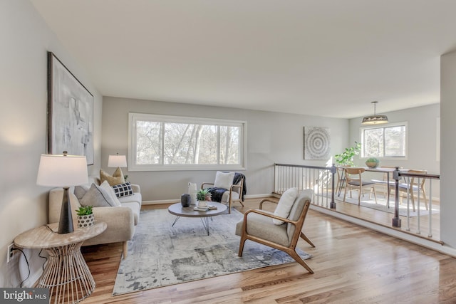 living room with wood finished floors and baseboards