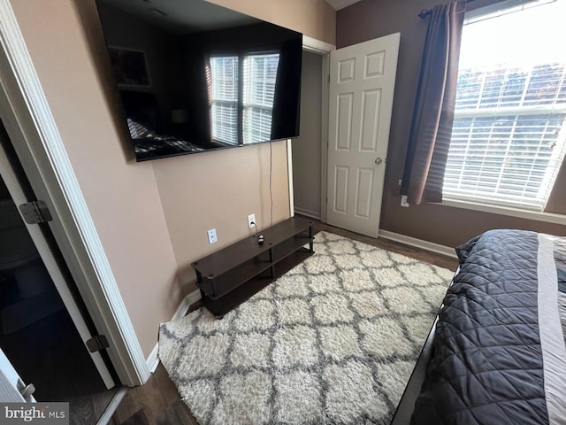 unfurnished bedroom featuring dark wood-type flooring