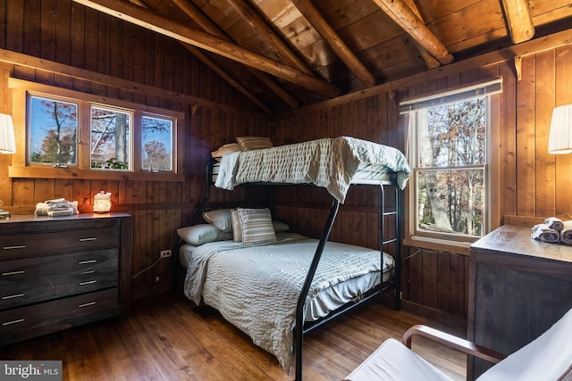 bedroom with dark hardwood / wood-style flooring, vaulted ceiling with beams, wood ceiling, and wood walls