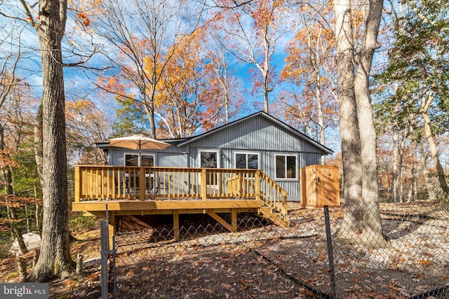 rear view of house featuring a deck