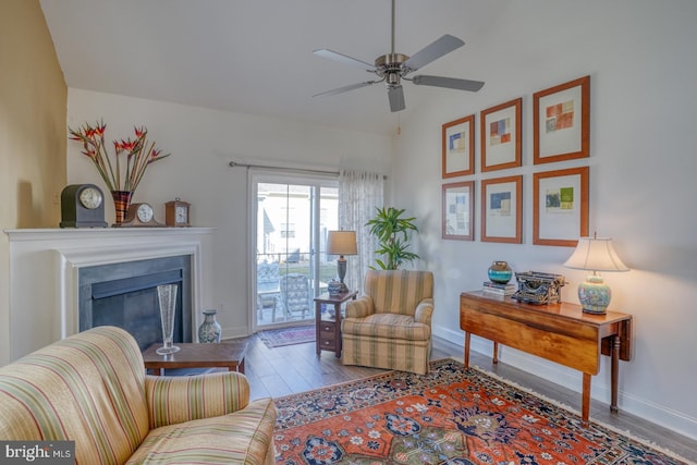 living room featuring light wood-type flooring and ceiling fan