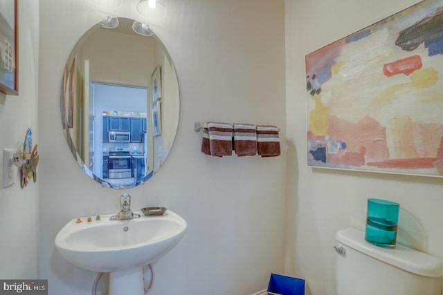 bathroom with toilet and sink