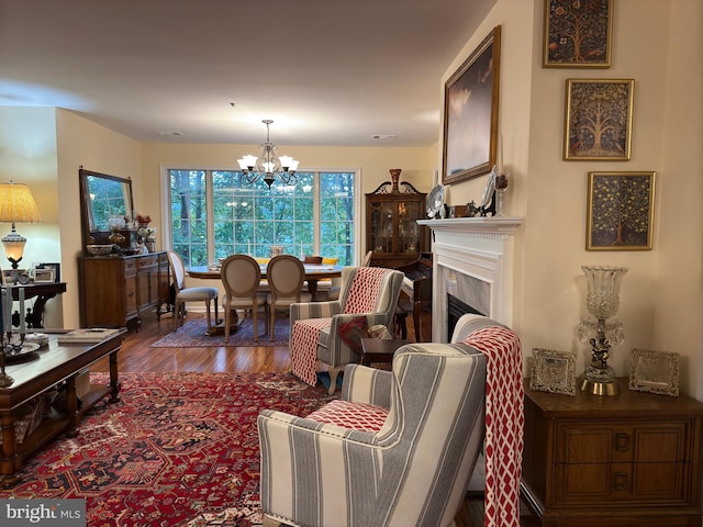 living room featuring a notable chandelier and hardwood / wood-style flooring