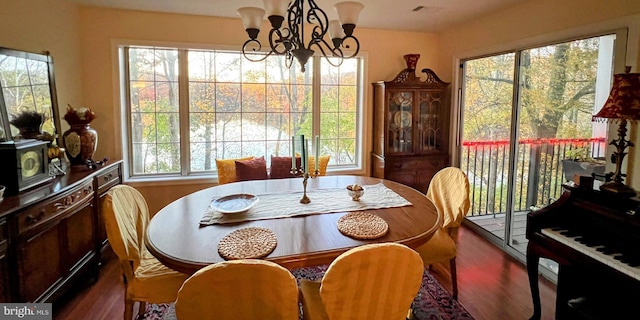 dining space featuring a chandelier and hardwood / wood-style floors