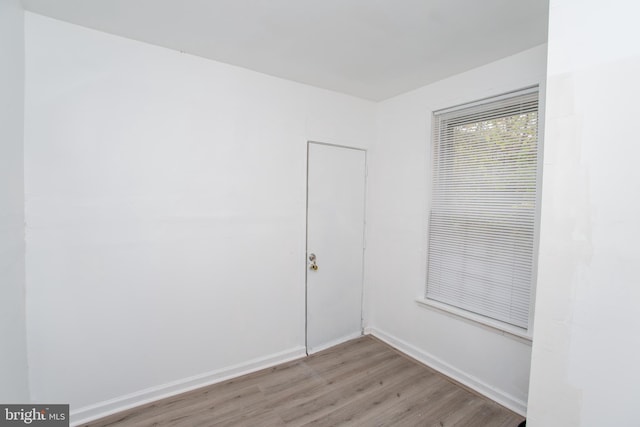 spare room featuring light hardwood / wood-style floors