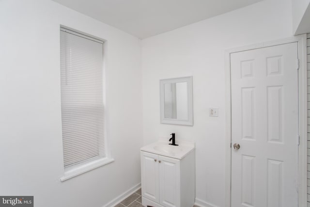 bathroom with tile patterned floors and vanity