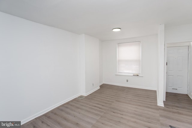 unfurnished room featuring light hardwood / wood-style floors