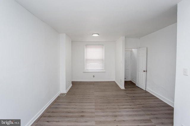 unfurnished room with light hardwood / wood-style floors