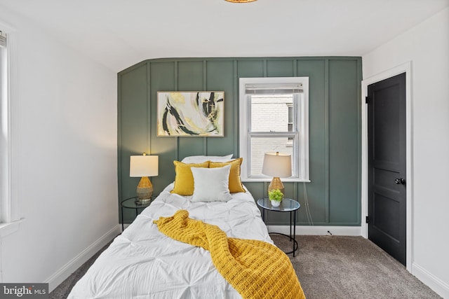 bedroom with carpet and lofted ceiling