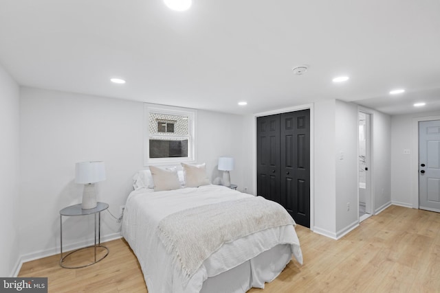 bedroom featuring hardwood / wood-style flooring and a closet