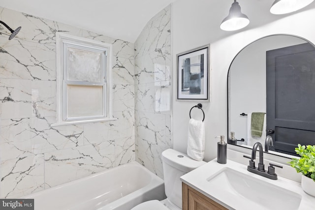 full bathroom with vanity, toilet, and tiled shower / bath combo