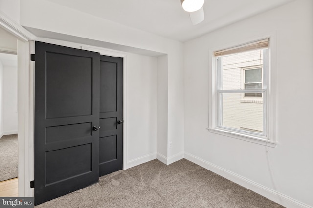 unfurnished room with light carpet and ceiling fan