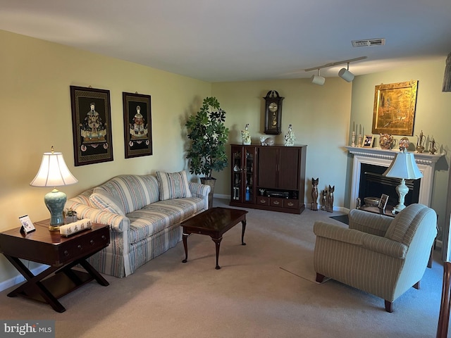 living room featuring light carpet and rail lighting