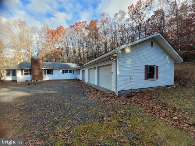 view of property exterior featuring a garage