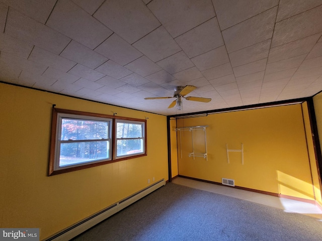 interior space featuring ceiling fan, carpet floors, and a baseboard radiator