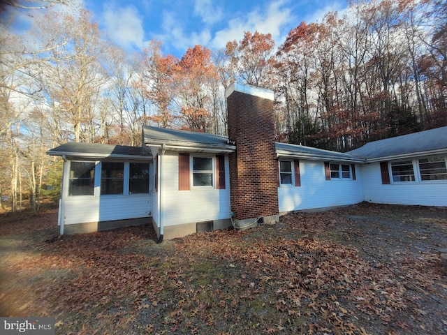 view of side of property with a sunroom