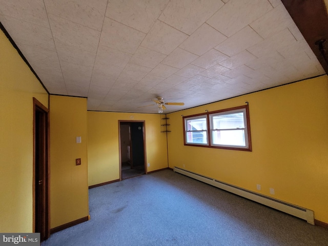 unfurnished room featuring ceiling fan, carpet floors, and a baseboard heating unit