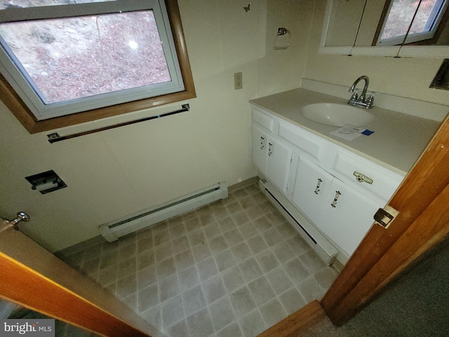 bathroom featuring vanity and a baseboard heating unit