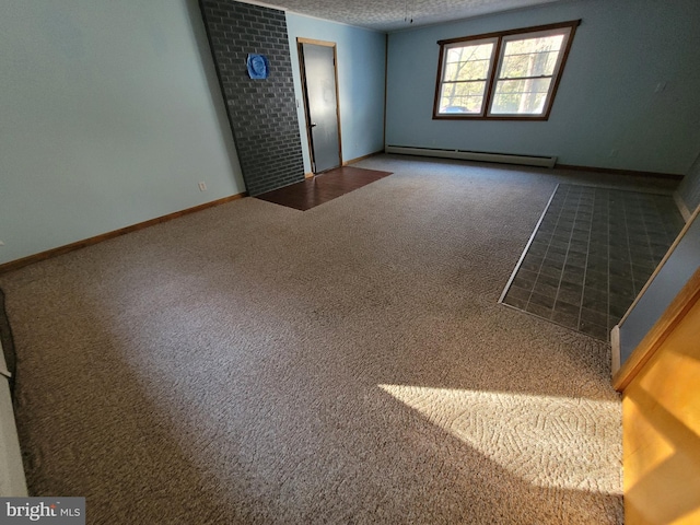 empty room with baseboard heating, carpet flooring, and a textured ceiling