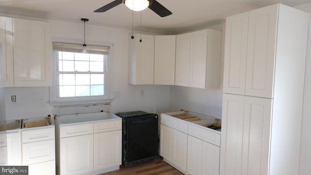 kitchen featuring refrigerator, light countertops, hanging light fixtures, white cabinets, and ceiling fan