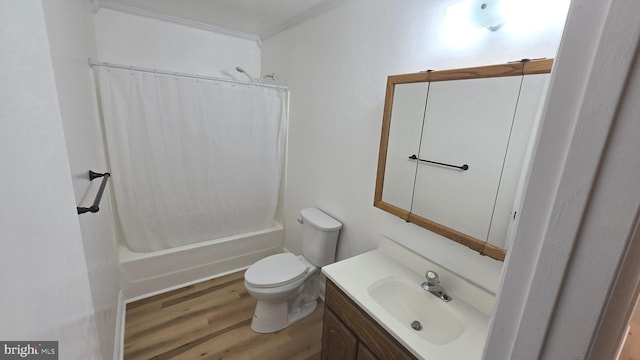 full bath with shower / bathtub combination with curtain, vanity, toilet, and wood finished floors