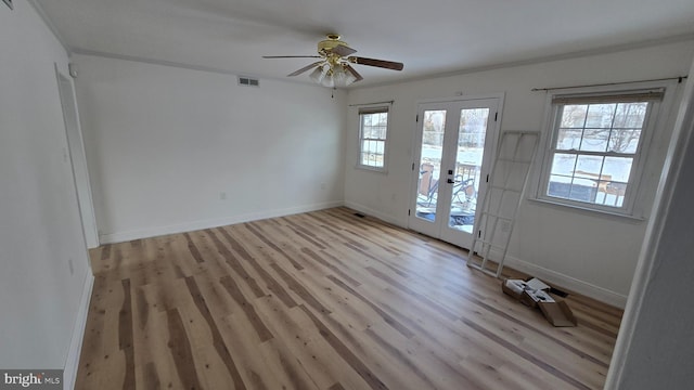 interior space with ceiling fan, light hardwood / wood-style floors, and french doors