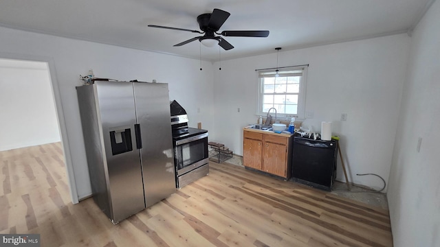 kitchen with light wood-style flooring, a ceiling fan, stainless steel appliances, and a sink