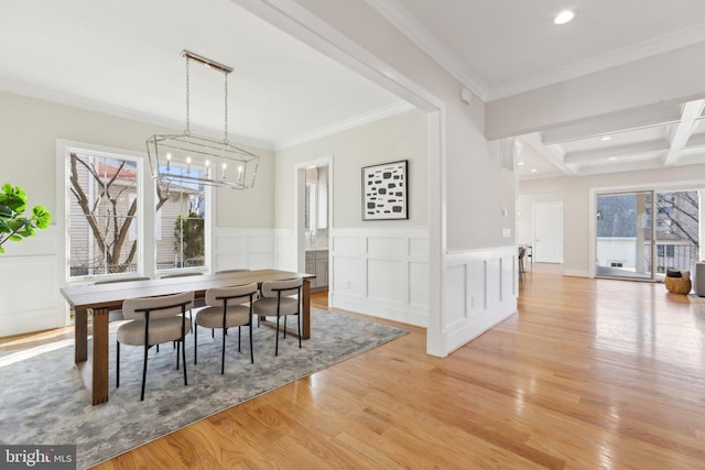 dining area with beamed ceiling, crown molding, coffered ceiling, and light hardwood / wood-style floors