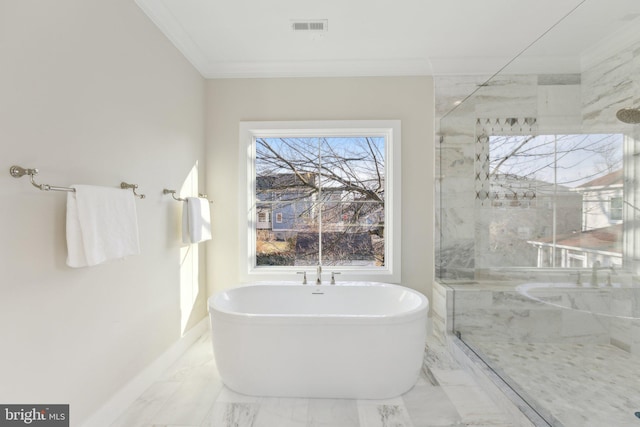 bathroom featuring a bathing tub and crown molding