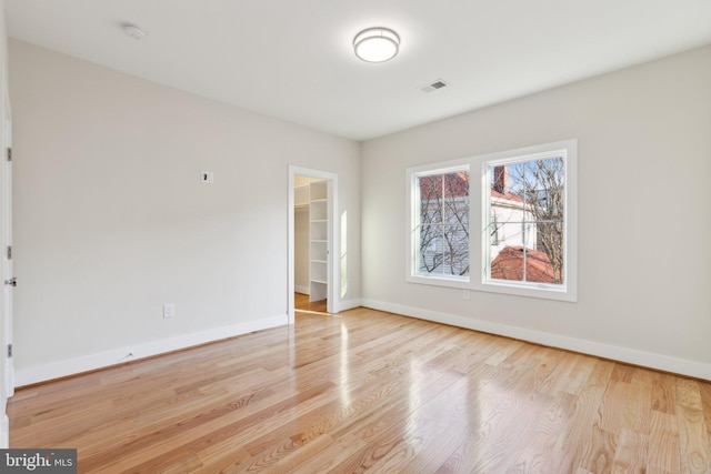 spare room featuring light wood-type flooring