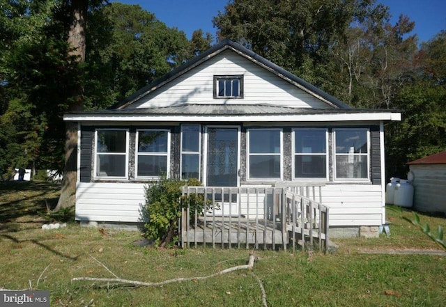 back of property featuring a sunroom