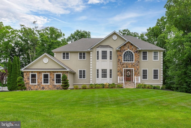 colonial home with a front yard