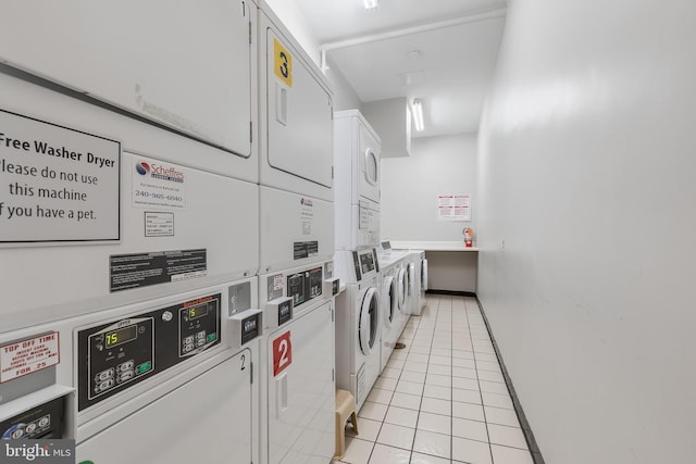 washroom featuring independent washer and dryer, stacked washer / dryer, and light tile patterned flooring